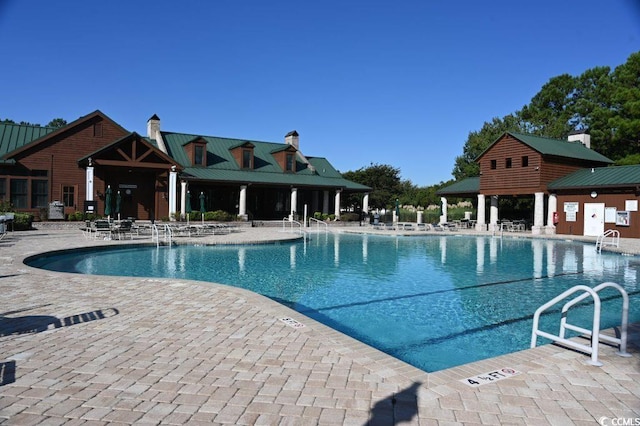 view of swimming pool featuring a patio area