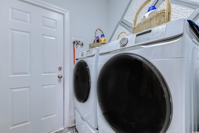 laundry room with separate washer and dryer