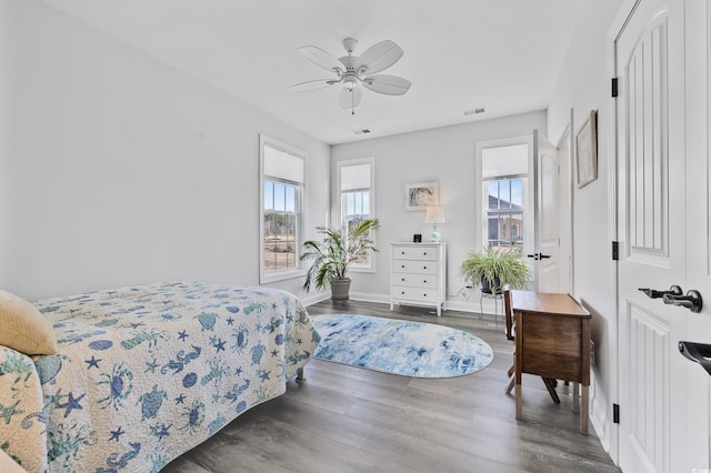 bedroom featuring dark hardwood / wood-style floors and ceiling fan