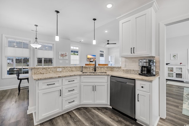 kitchen with dishwasher, sink, white cabinets, and kitchen peninsula