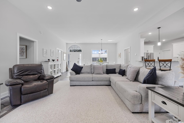 living room featuring a chandelier