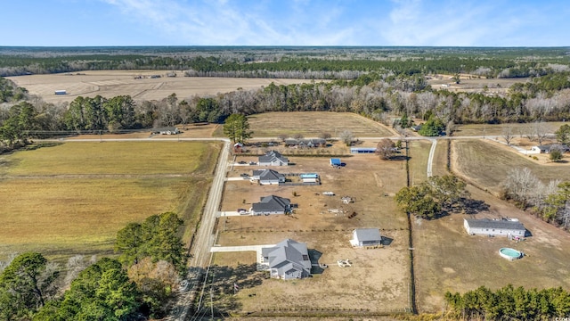 birds eye view of property with a rural view