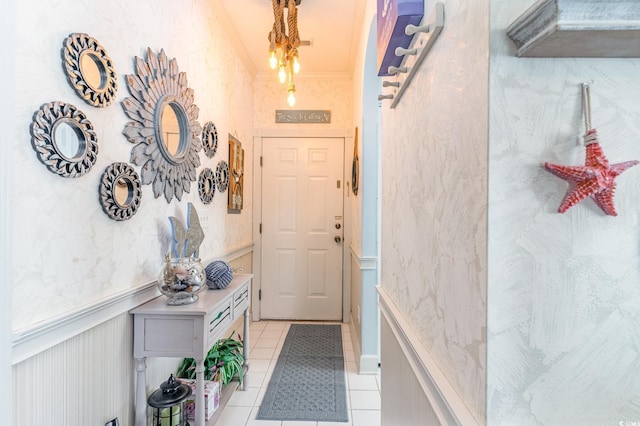entryway featuring wainscoting and light tile patterned floors