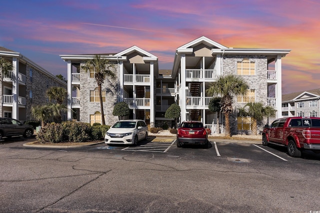 view of property with uncovered parking