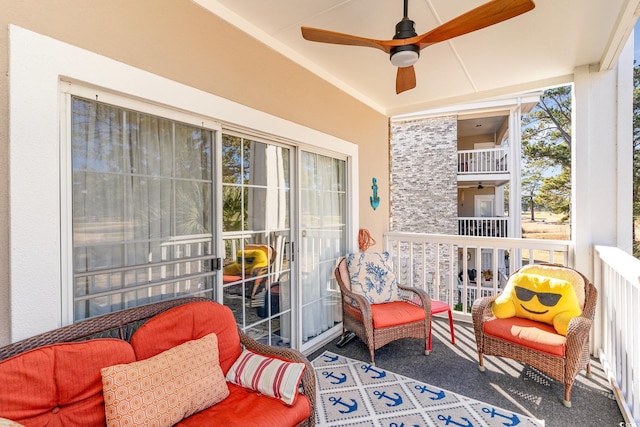 sunroom with a ceiling fan