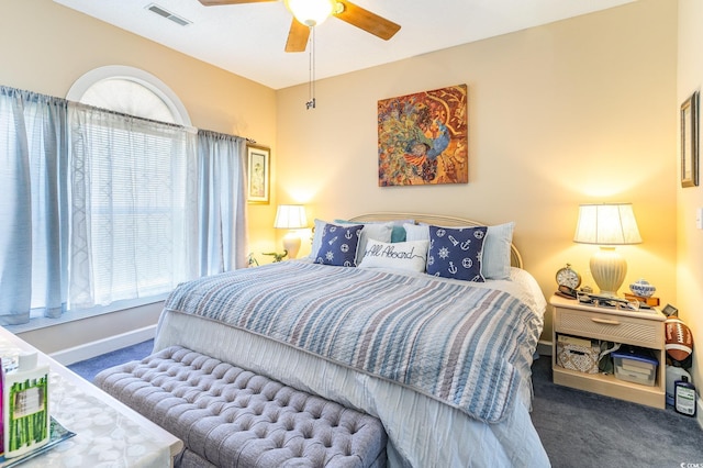 carpeted bedroom featuring a ceiling fan, baseboards, and visible vents