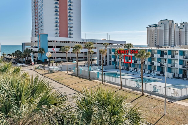 view of swimming pool with a water view