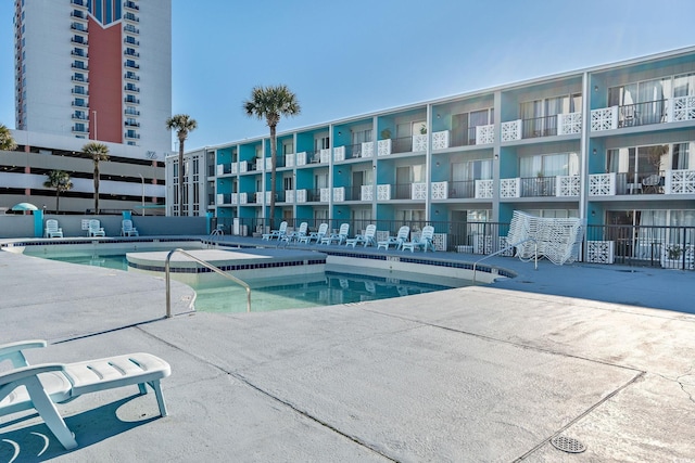 view of swimming pool featuring a patio area