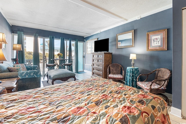 tiled bedroom featuring a textured ceiling and access to outside