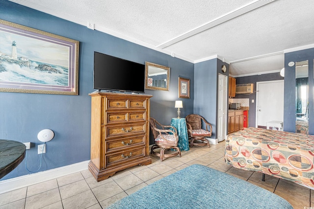 tiled bedroom featuring crown molding, a wall unit AC, and a textured ceiling