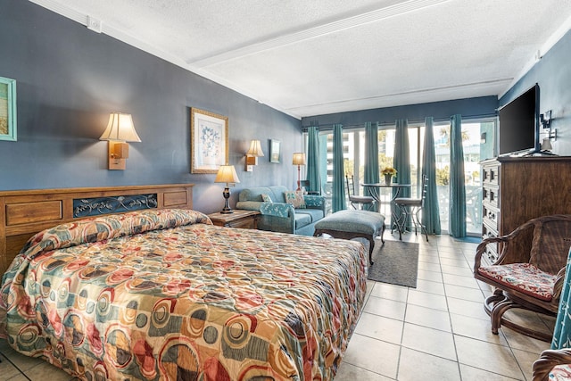 tiled bedroom with access to outside and a textured ceiling