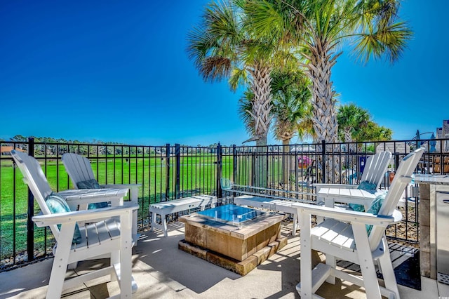 view of patio / terrace with an outdoor fire pit