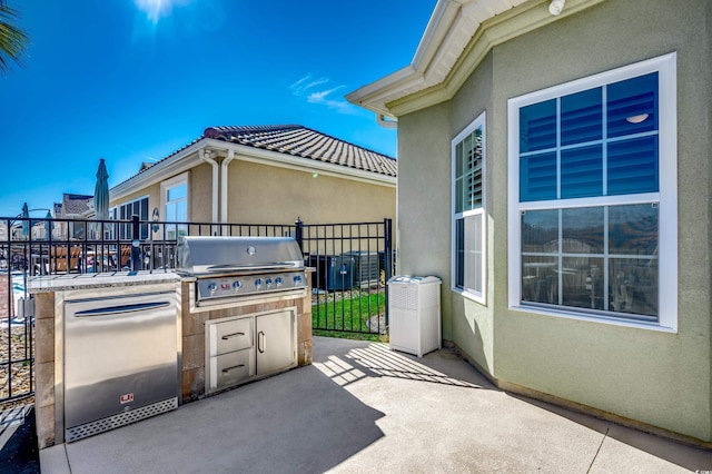 view of patio / terrace with a grill and exterior kitchen