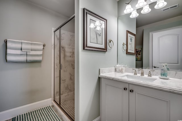 bathroom with vanity and walk in shower