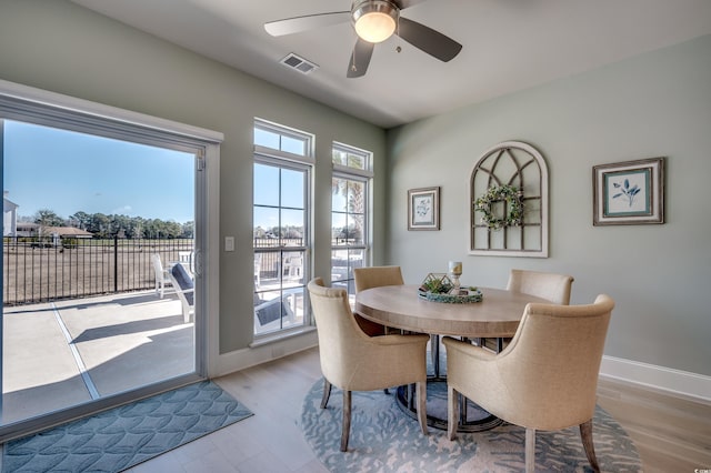 dining room featuring ceiling fan and light wood-type flooring