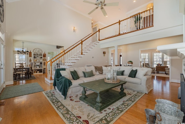 living room featuring hardwood / wood-style floors, a high ceiling, and a wealth of natural light