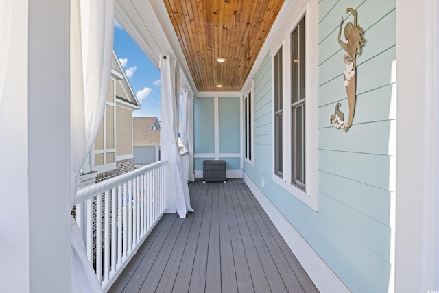 wooden terrace with a porch