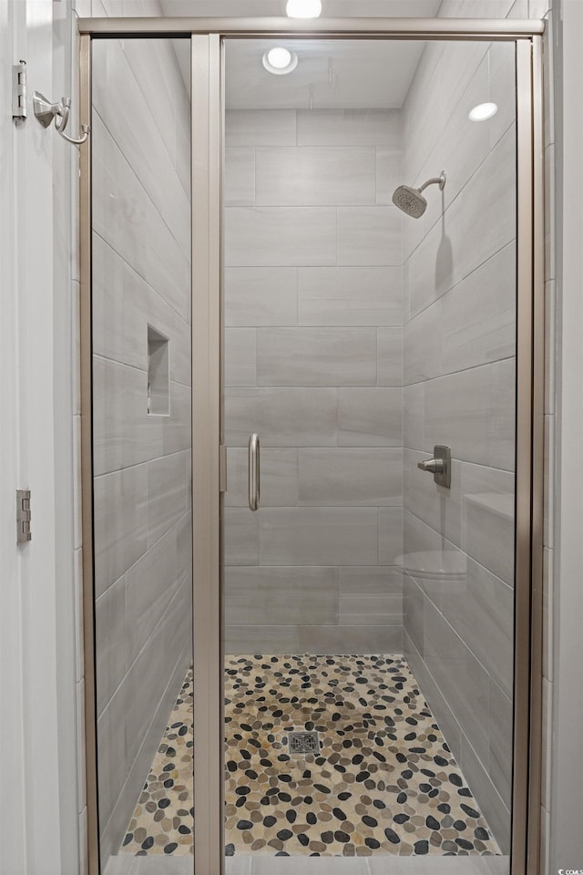 bathroom featuring a shower stall