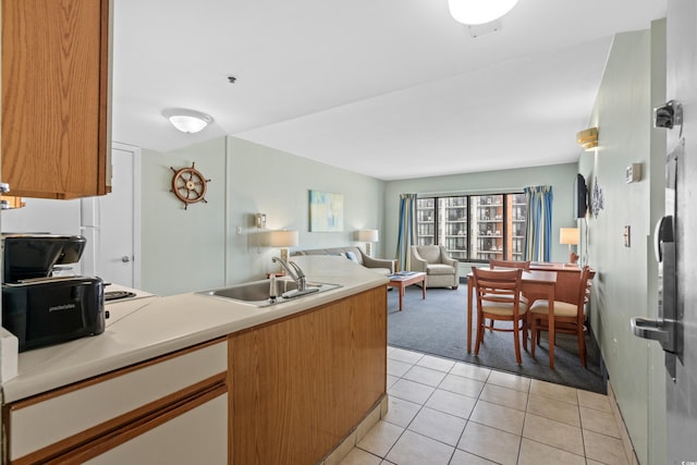 kitchen with sink and light tile patterned floors