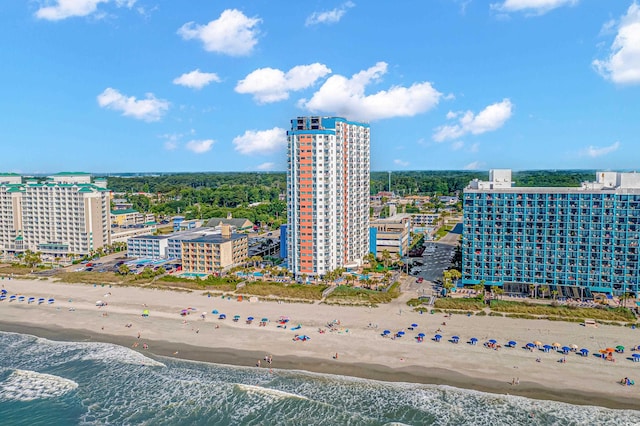 drone / aerial view with a beach view and a water view