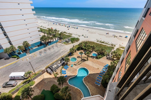 bird's eye view featuring a beach view and a water view