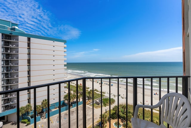 balcony with a beach view and a water view