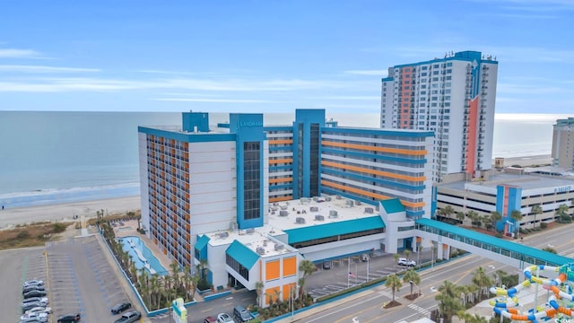 birds eye view of property with a view of the beach and a water view