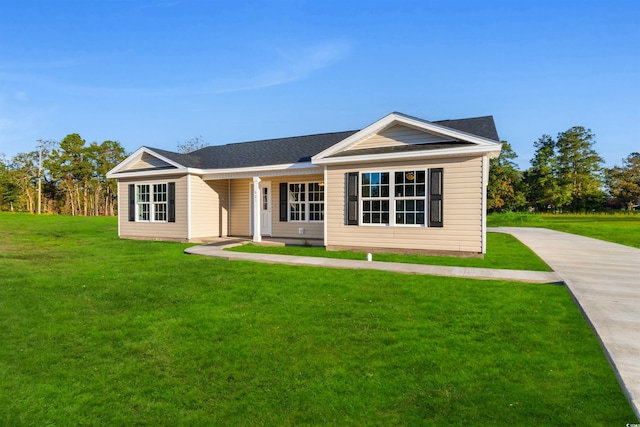 ranch-style home featuring a front yard