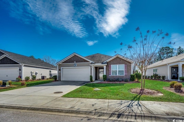 ranch-style house featuring a garage and a front lawn