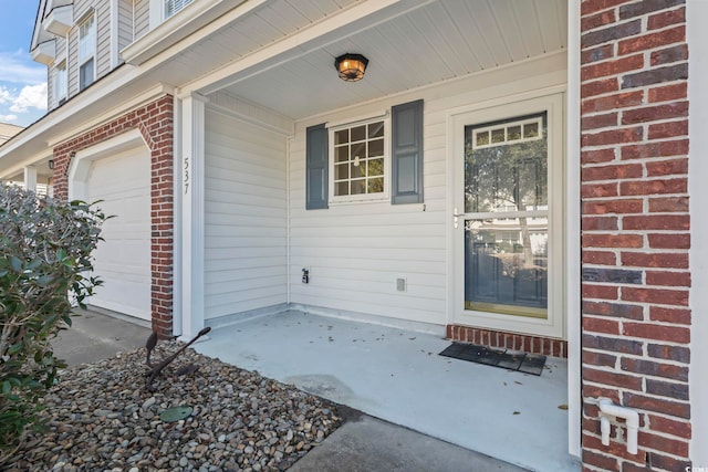 property entrance with a garage