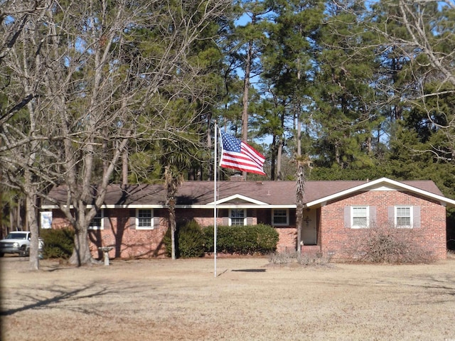 ranch-style house with a front lawn