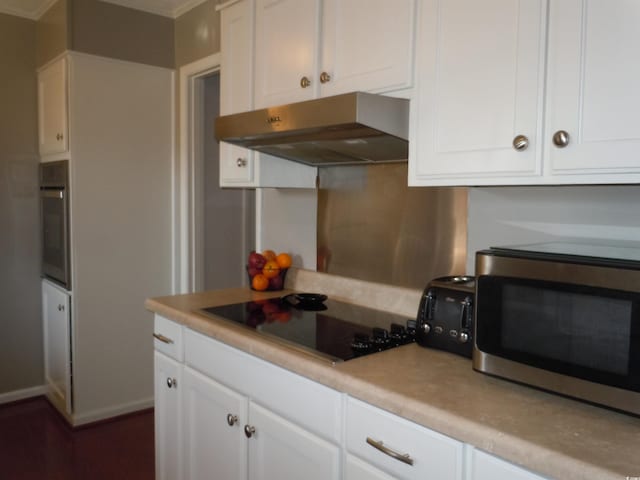 kitchen featuring white cabinetry and stainless steel appliances