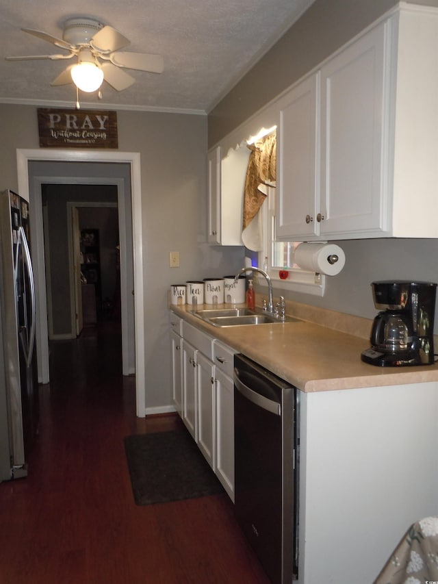 kitchen featuring sink, crown molding, stainless steel appliances, and white cabinets