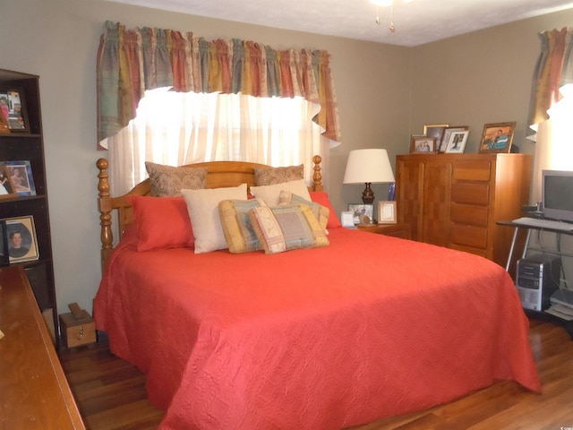 bedroom featuring hardwood / wood-style floors