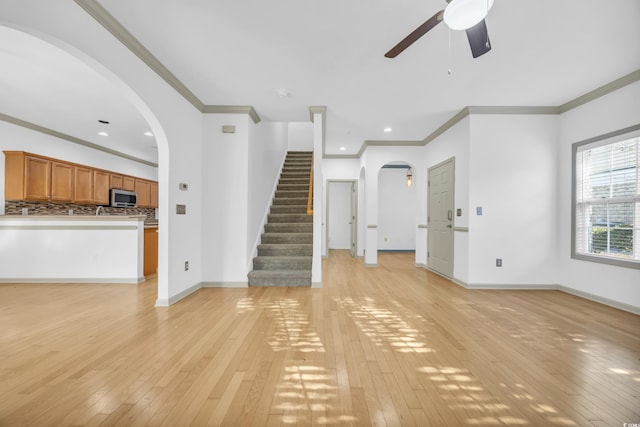 502 Hay Hill Ln Unit B, Myrtle Beach, SC 29579 - unfurnished living room with crown molding, ceiling fan, and light hardwood / wood-style flooring
