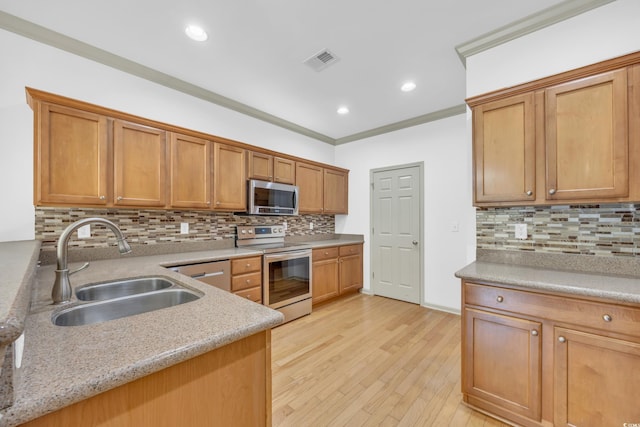 502 Hay Hill Ln Unit B, Myrtle Beach, SC 29579 - kitchen with sink, stainless steel appliances, ornamental molding, decorative backsplash, and light wood-type flooring