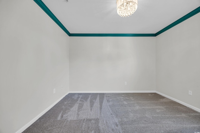 502 Hay Hill Ln Unit B, Myrtle Beach, SC 29579 - carpeted spare room featuring an inviting chandelier and ornamental molding