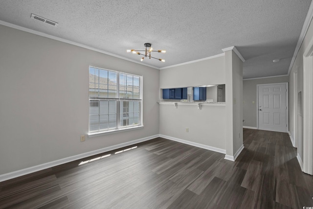 unfurnished living room with an inviting chandelier, crown molding, dark wood-type flooring, and a textured ceiling