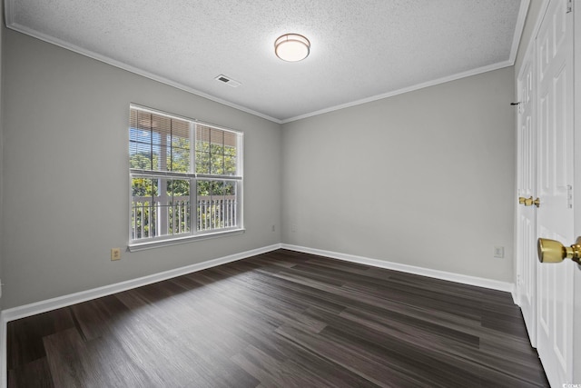 empty room with ornamental molding, dark wood-type flooring, and a textured ceiling