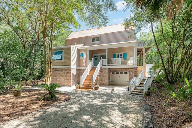 view of front of home with a garage and covered porch