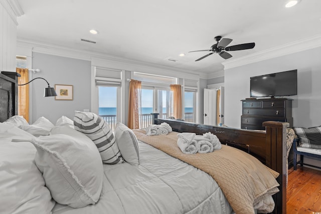 bedroom featuring access to exterior, wood-type flooring, and ornamental molding