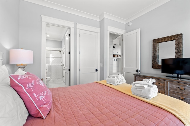 bedroom featuring ornamental molding and ensuite bathroom