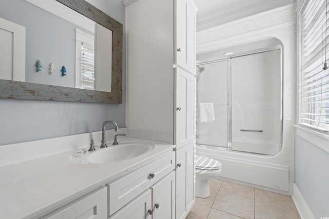 full bathroom featuring toilet, vanity, shower / bath combination with glass door, and tile patterned flooring