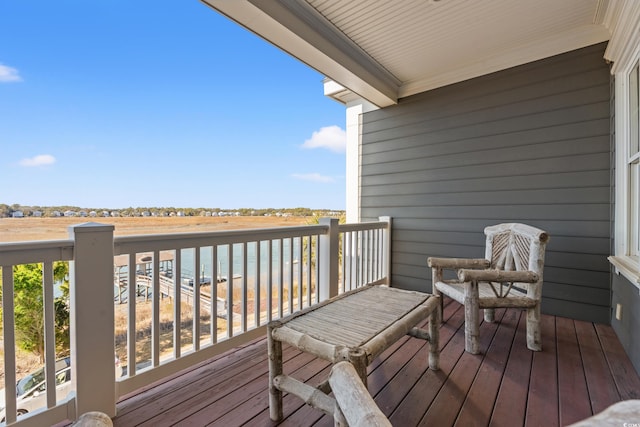 wooden deck featuring a water view