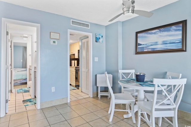 dining room with ceiling fan and light tile patterned floors