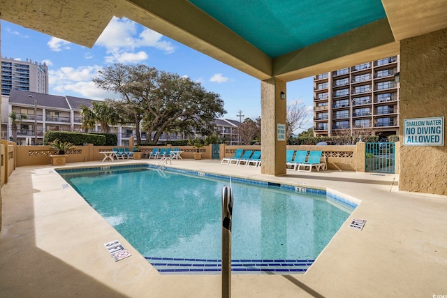 view of swimming pool featuring a patio