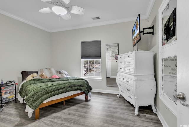 bedroom with crown molding, wood-type flooring, and ceiling fan