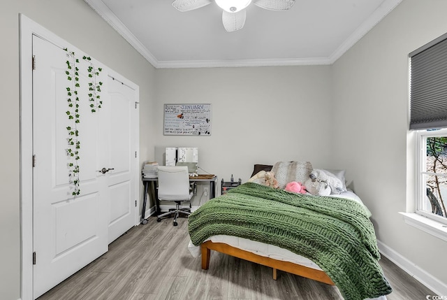 bedroom with ornamental molding and light wood-type flooring