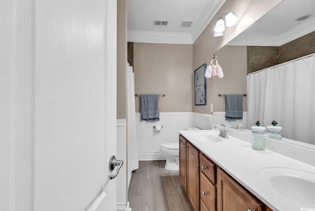 bathroom featuring crown molding, hardwood / wood-style flooring, vanity, a shower with curtain, and toilet