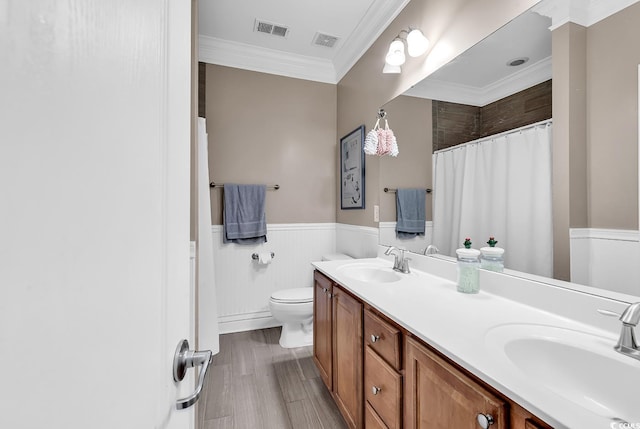 bathroom featuring hardwood / wood-style floors, vanity, ornamental molding, a shower with curtain, and toilet